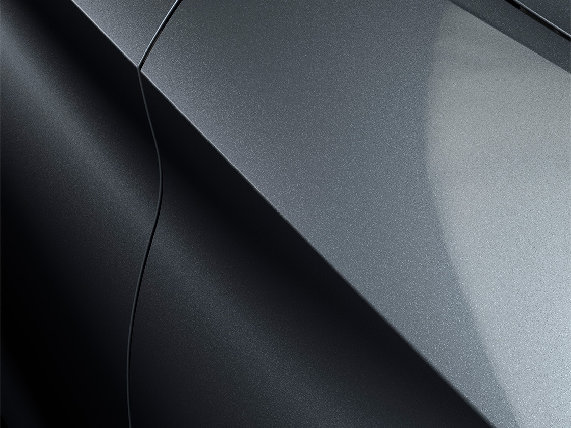 Seat León Sportstourer FR en gris Magnetic con un acabado metalizado, primer plano. 