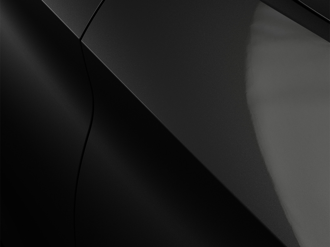 Seat León Sportstourer en negro Midnight con un acabado metalizado, primer plano.