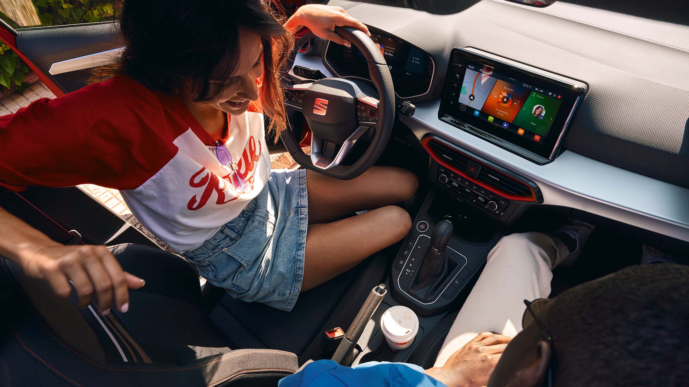 woman sitting inside seat ibiza holding steering wheel